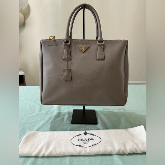 Prada Handbags - Prada Taupe Leather Handbag with Gold Accents